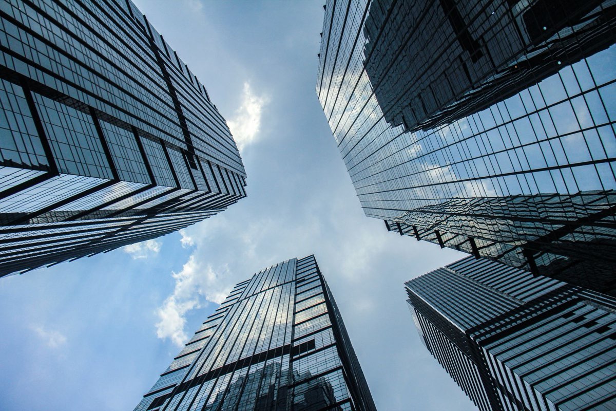 Modern commercial towers rising against a clear sky